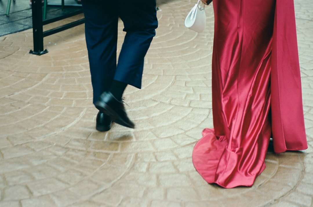 Celebrity couple walking on a red carpet at a gala event
