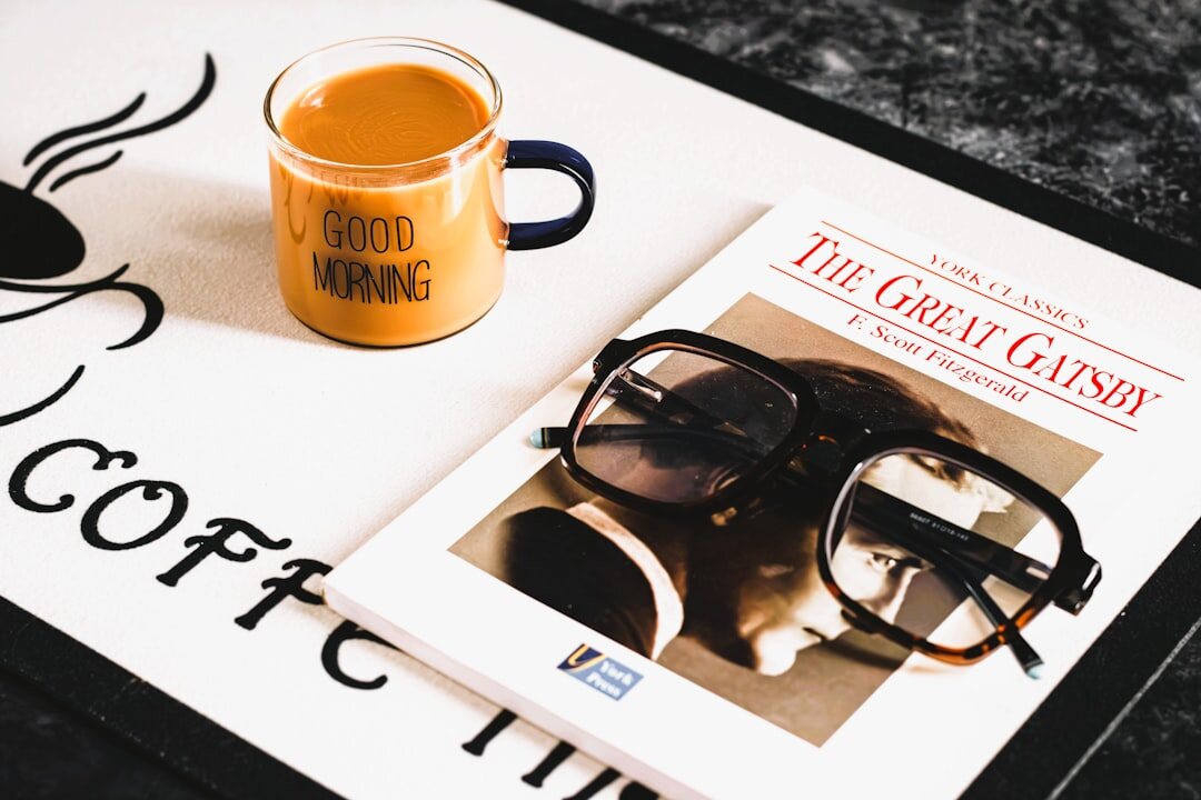 Flat lay of magazines and a coffee cup on a table