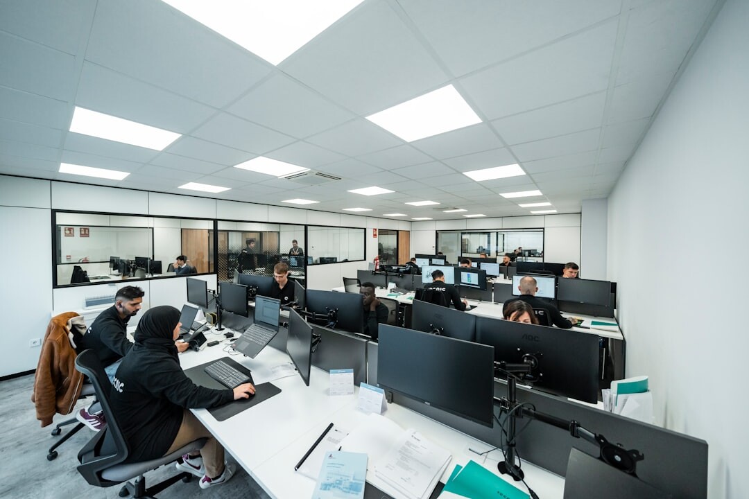 Journalists working in a modern newsroom office