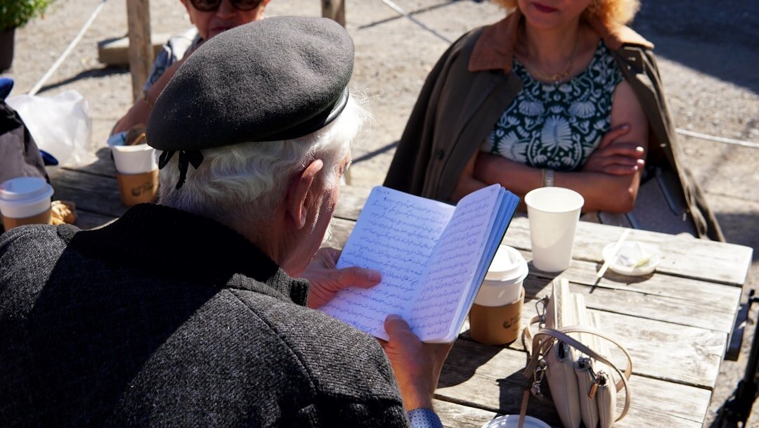 person writing in notebook
